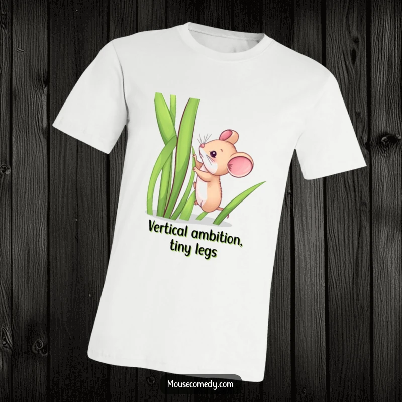 Funny t-shirt depicting a tiny, fuzzy mouse mid-climb on an impossibly tall blade of grass, conveying a humorous struggle.