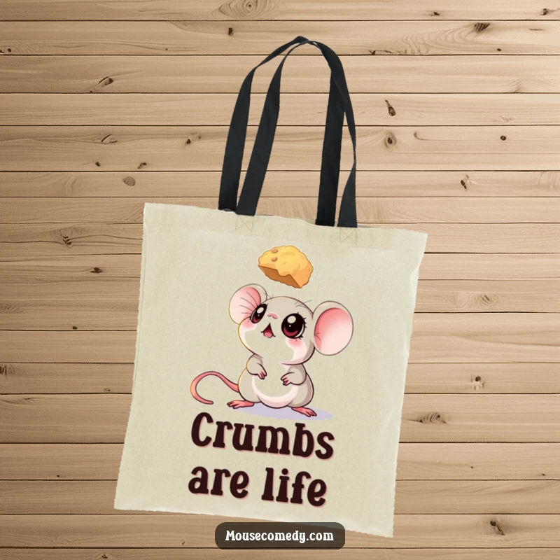 Funny mouse tote bag with a mouse’s big eyes fixed upwards on a hovering crumb, symbolizing desire.